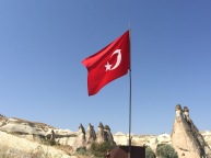 Fairy Chimneys beneath the flag- Goreme, Turkey